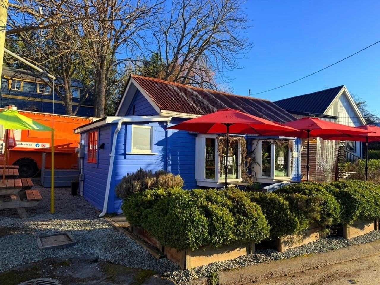 Switchboard Cafe, the blue cottage with red umbrellas on Hereford Avenue