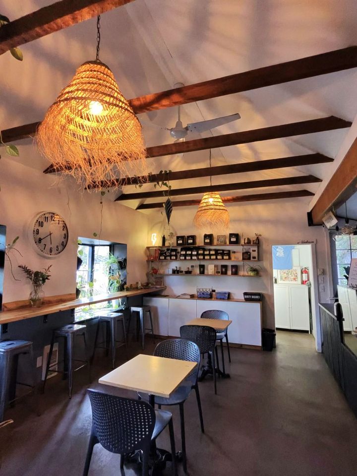 Inside the cafe: the counter, the shelf and the beams